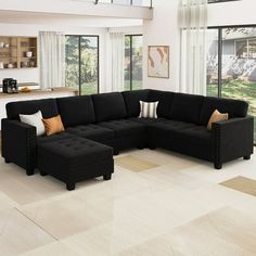 a large black sectional couch in a living room