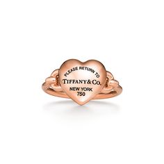 A bold expression of love, inspired by those who fill up your heart. Tiffany artisans have transformed the classic Return to Tiffany® tag into a three-dimensional heart with a special casting technique. The 18k rose gold pieces in this collection feature layers of black rhodium applied by hand for a striking finish. Playfully proportioned, each heart is hand polished for maximum shine. 18k rose gold; Motif size, mini | Return to Tiffany® Full Heart Ring in Rose Gold, Size: 7 Tiffany And Co Jewelry Gold, Tiffany Gold Ring, Tiffany Heart Ring, Tiffany And Co Ring, Tiffany Ring, Tiffany Co Rings, Gold Tiffany, Gold Motif, Tiffany Rings