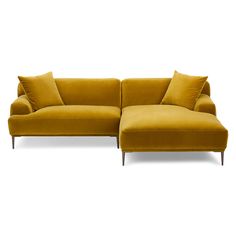 a yellow couch with pillows on it