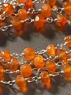 Beautiful orange sunrise carnelian faceted beads with hand work silver connectors, sterling silver lobster claw clasp adjustable length beaded chain 16-18" From my bricks and mortar store collection. All inventory from my store in Cooperstown, NY will be listed here. watch for many more items and discounted pricing...everything must go, so make an offer ! thank you! Item # 330 Orange Sunrise, Cooperstown Ny, Faceted Bead Necklace, Orange Orange, November Birthstone, Hand Work, Faceted Bead, Beaded Chain, 50 50