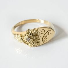 This vintage-inspired floral ring is a row of dainty flowers wrapped around your fingers. Handmade and polished, it is available in solid 8K and 14K gold. This item is engravable with text or monogram of your choice at no extra cost. The initals are engraved onto the ring and embedded in the 3D model for a flawless embossed finish. It is also possible to add a diamond or birthstone or diamond to this ring at an additional fee. Please inquire for details. A few notes about our gold:- Though we do Heirloom 14k Gold Initial Ring For Wedding, Heirloom 14k Gold Flower Ring With Rose Cut Diamonds, Heirloom Rose Gold Initial Ring For Wedding, Anniversary Jewelry With Rose Cut Diamonds In Flower Shape, Flower Shaped Rose Cut Diamond Jewelry For Anniversary, Birth Flower Fine Jewelry Ring For Wedding, Flower-shaped Rose Cut Diamond Jewelry For Anniversary, Vintage 14k Gold Flower Ring For Formal Occasions, Personalized Heirloom Diamond Wedding Ring