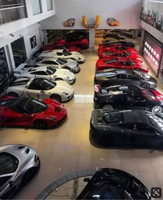 a room filled with lots of different colored cars