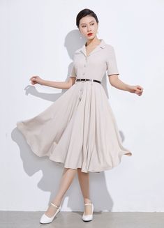 Classic Summer A-line Shirt Dress, Classic A-line Vintage Dress With Buttons, Classic A-line Vintage Dress With Button Closure, Elegant Vintage Short Sleeve Summer Dress, Elegant Beige A-line Shirt Dress, Fitted Collared Neckline Shirt Dress For Summer, Elegant Vintage Dress With Button Closure For Work, Fitted Midi Dress With Button Closure And Collared Neckline, Classic Collared Dress