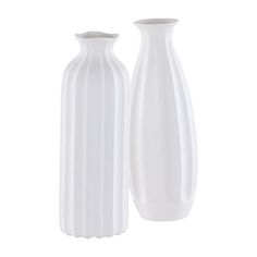 two white vases sitting next to each other on a white background, one is empty