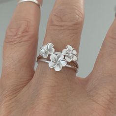 Sterling Silver Satin Plumeria Flower Ring With Only One Cz, Plumeria Ring, Silver Rings, Floral Ring, Flower Ring, Hawaii Ring, 925 Stamped, Boho Ring, Cz Ring Face Height: 13 Mm (0.52 Inch) Finish: Satin Material: 925 Sterling Silver Silver Flower Charm Ring For Wedding, Chandi Rings Design, Sterling Silver Flower Ring For Wedding, Delicate Silver Flower-shaped Ring, Delicate Silver Flower Ring, Silver Delicate Flower Shaped Ring, Delicate Silver Ring With Flower Shape, Sterling Silver Flower Ring Fine Jewelry, Anniversary Jewelry With 3d Flower Details