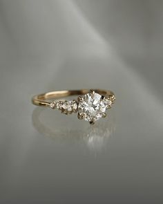 an engagement ring with three diamonds on it