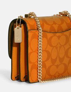 Signature coated canvas and smooth leatherInside multifunction and zip pocketsSnap closure, fabric liningOutside open pocketHandles convert to shoulder strap with 22" drop7" (L) x 5 1/4" (H) x 2" (W)Style No. C9946Color: Light Orange Luxury Orange Coach Bag, Luxury Orange Coach Shoulder Bag, Coach Hudson Small Pack, Orange Guess Duffel Crossbody Purse, Coach Bag Orange, Mini Pepper Crossbody Coach, Coach Crossbody Bag Yellow, Lighted Canvas, Signature Canvas