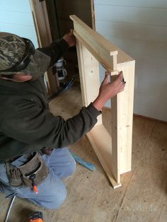 a man is working on some wood