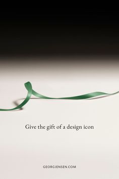 a green ribbon with the words give the gift of a design icon written on it