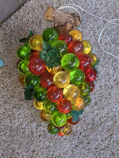 a bunch of colorful glass beads on the floor