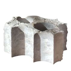 an object made out of concrete blocks on a white background