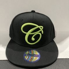 Elevate your style with this vintage Coogi brand fitted cap. The colorful black and green pattern is perfect for any occasion, whether it be a casual outing or a party. Made of lightweight polyester and featuring a wide brim and breathable fabric, this baseball cap is both stylish and comfortable. The retro design with a 90s hip hop logo is perfect for those who love vintage fashion. This cap is great for those who want to add a unique touch to their outfit without compromising on comfort. Don't miss out on this rare find. Hip Hop Logo, 90s Hip Hop, Fitted Caps, Green Pattern, Wide Brimmed, Hat Sizes, Retro Design, Black Green, Baseball Cap