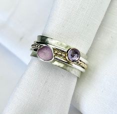 Limited Edition Beautiful hand made Purple Sea glass and Brazilian Amethyst Tri-band spinner ring made in Sterling Silver to fit UK O1/2-P1/2 Additional sizes are available here-  https://www.etsy.com/uk/listing/1613259015/limited-edition-beautiful-hand-made We are excited to offer a limited edition variation to our signature sea glass spinner rings, with these stunning Purple sea glass  and Brazilian Amethyst stone!  The main band is 9mm wide brushed finish sterling silver, with 3 smaller highl Glass Engagement Ring, Sea Glass Gifts, Purple Sea, Sea Glass Ring, Amethyst Stones, Mermaid Jewelry, Glass Jewellery, Glass Ring, Meditation Rings