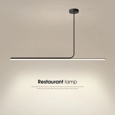 the restaurant lamp is hanging from the ceiling in front of an empty room with no people