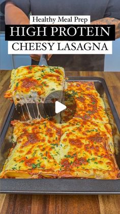 a person cutting into a cheesy lasagna casserole on a pan