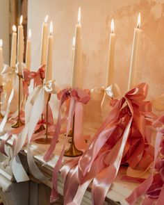 A line of tall candles on a mantlepiece with pink bows tied at the bottom Wedding Bows Diy, Ribbon Wedding Decorations, Back Garden Wedding, Garden Wedding Decor, Liverpool City Centre, Wedding Diy Ideas, Summer Wedding Diy, Bow Diy, Bows Pink