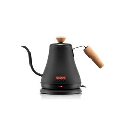 a black coffee pot with a cork in the top and an orange light on it