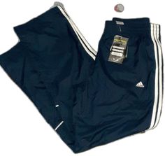 Sporty Blue Sweatpants With Three Stripes Branding, Blue Sporty Sweatpants With Three Stripes Branding, Blue Activewear For Jogging With Three Stripes, Casual Navy Bottoms For Sports Season, Sporty Blue Joggers With Three Stripes Branding, Blue Sweatpants With Three Stripes For Streetwear, Blue Adidas Activewear For Jogging, Adidas Blue Activewear With Three Stripes, Adidas Blue Sweatpants For Jogging