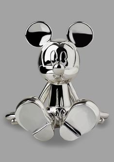 a mickey mouse figurine is shown on a white background