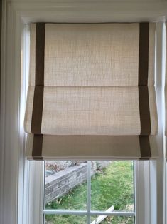 a window with a roman blind in it