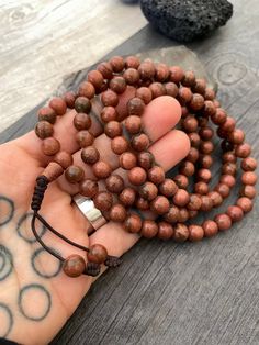 Unique and powerful Goldstone Japa mala Necklace from Nepal. A unisex piece that will be perfect for your day by day outfits and will be easy to match any other accessories. If it fits right can be a bracelet also. This is also a Buddhist praying 108 beads mala. The japa mala is 42.5cm- 16.75 inch long A unique addition to your jewelry collection. Enjoy Con salud Earthy Healing Beads, Spiritual Beaded Mala For Festival, Spiritual Wooden Beaded Healing Bracelets, Spiritual Mala With Round Beads For Festival, Brown Polished Beads Spiritual Mala, Bohemian Hand-strung Mala With Round Beads, Spiritual Brown Mala With Polished Beads, Brown Spiritual Mala With Polished Beads, Spiritual Brown Beaded Bracelets With Gemstone Beads