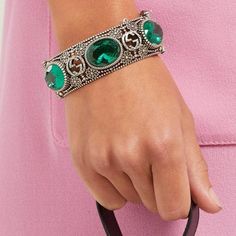 Bracelet is crafted in Italy with the namesake motif interspersed with flowers - an archival tradition of the house - punctuated with faceted green crystals, and secures with a tiger - head bayonet fastening, for a sense of old-world elegance.Sterling silverMaximum width of band 1.1in/2.9cm Maximum width of opening 2.4in/6cm Inner width when closed 2.4in/6cmMade in Italy Designer Green Jewelry For Formal Occasions, Designer Jubilee Bracelet Jewelry In Metal, Elegant Engraved Gucci Jewelry, Designer Metal Jubilee Bracelet, Designer Green Jewelry As A Gift, Designer Green Jewelry For Gifts, Designer Green Jewelry As Gift, Silver Luxury Crystal Bracelet, Elegant Silver Jeweled Crystal Bracelet