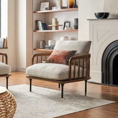 a living room filled with furniture and a fire place in front of a book shelf