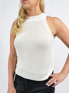 This knit tank features a relaxed fit and a mid-weight material. It is very versatile and can be dressed up or down. FABRIC 96% Rayon, 4% Spandex SIZE & FIT Fits true to size; For a looser fit size up Model is 5'6" wearing size small Casual White Ribbed Knit Top, Spring Stretch Textured Knit Tank Top, Spring Textured Knit Stretch Tank Top, White Textured Knit Sleeveless Sweater Vest, Casual Tank Knit Top For Day Out, White Stretch Knit Top For Layering, Versatile White Tank Top For Layering, Textured Knit Tank Top, Stretch Solid Knit Top For Day Out