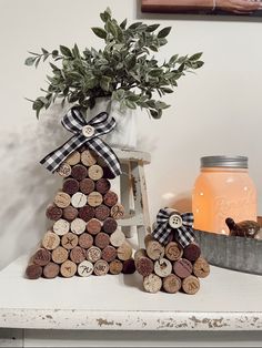 a tree made out of wine corks with a jar of honey in the background