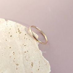 Elevate your style with our handcrafted 14k gold-filled stacking ring. Each ring is meticulously crafted, ensuring that every piece carries the artistry of handmade excellence. The result? A one-of-a-kind ring, as unique as you. This can be your everyday ring. Handcrafted in USA Sold by one ring DETAILS: Material: 14/20 Gold filled Dimensions: Width 1.3mm Note: As each piece is totally handcrafted dimensions and shapes can slightly vary ensuring no two are exactly alike. Extraordinary Jewelry, Everyday Ring, Gold Bond, Everyday Rings, One Ring, Halo Ring, Oils For Skin, Halo Rings, Stacking Ring