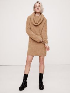 An invitation to play with proportions, this soft and warm sweater dress is cut with an oversized silhouette and a dramatic, funnel neck so you can drape and style as you please.  For fabric, we reached for one of our favorite fuzzy yarns, spun from a blend of luxurious alpaca.  Oversized fit.  Funnel neck.  Slip-on styling.  Unlined.  Oversized fit.  Long sleeves.  Above-knee length.  Model: Size S, 5'10" Oversized Winter Mini Dress, Winter Mini Sweater Dress For Loungewear, Cozy Winter Mini Dress, Oversized Knee-length Mini Dress For Fall, Cozy Fall Loungewear Dresses, Oversized Brown Dress For Winter, Cozy Loungewear Dresses For Fall, Cozy Soft Knit Long Sleeve Dress, Cozy Long Sleeve Soft Knit Dress