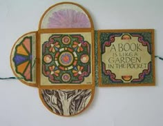 a book is like a garden in the pocket with an ornament on it