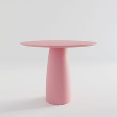 a pink round table on a white background