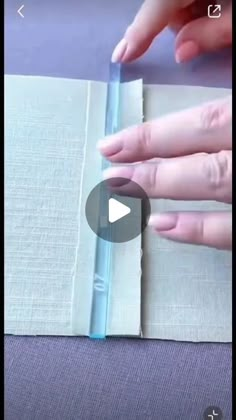 someone is cutting out the edge of a piece of fabric