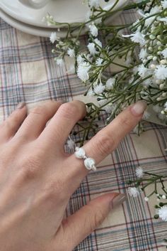 Delicate Adjustable White Flower Ring, Delicate White Adjustable Flower Ring, White Open Ring With Pearl Charm, Adjustable Pearl Charm Ring For Wedding, White Open Ring With Pearl Drop, Adjustable Wedding Ring With Pearl Charm, Open Ring With White Pearl Drop, White Pearl Open Ring, Wedding Ring With Pearl Charm