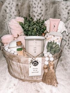 a basket filled with lots of items sitting on top of a white fur covered floor