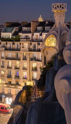 a clock on the side of a building at night