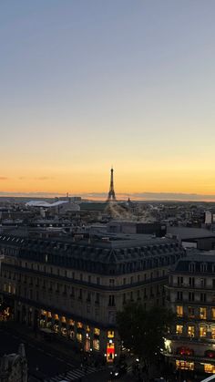 the eiffel tower is lit up at night