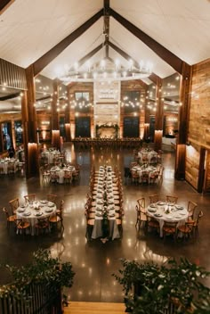 an overhead view of a dining hall with tables and chairs set up for formal function