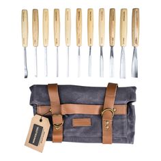 a set of knives and sheaths in a bag next to each other on a white background