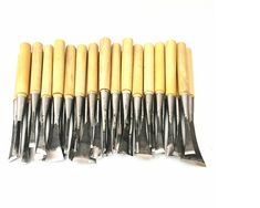 seven yellow and silver tools lined up next to each other