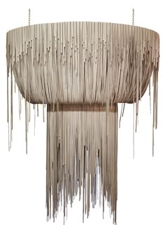 a chandelier made out of sticks with icicles hanging from the top and bottom