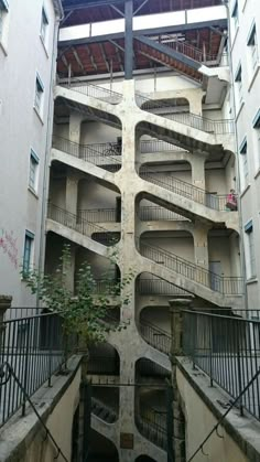 an apartment building with stairs and balconies