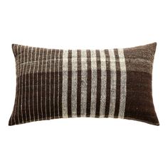 a brown and white striped pillow on a white background