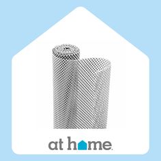 two rolls of silver mesh sitting next to each other on top of a blue background