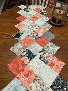 a table runner made out of patchwork fabric