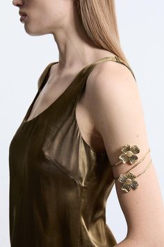 Add Intricate Detail To Any Occasion Look With Our Arm Cuff. Featuring A Large, Floral Design, This Cuff Is Perfect For Injecting Some Personality Into Your Look. Wear Them On Wedding Guest Days, To Party Nights, And Holiday Evenings. Metal Flower Arm Cuff Shimmering, Metallic Colouring Three Dimensional Floral Detailing Unique Cuff Design Statement Large Size Flower Arm Cuff, Arm Cuff Jewelry, Gold Arm Cuff, Petite Wedding Guest Dresses, Upper Arm Cuff, Arm Bangles, Upper Arm Cuffs, Latest Bracelets, Design Journal