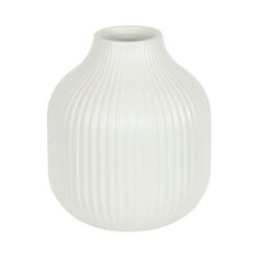 a white vase sitting on top of a table