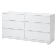 a white dresser with four drawers