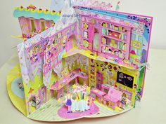 the doll house is made out of paper